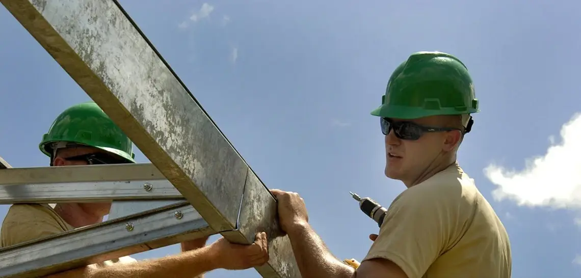 construction workers with metal framing